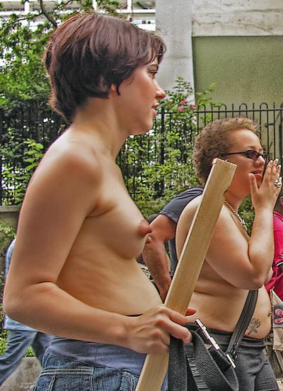 lesbian protester with bare breasts