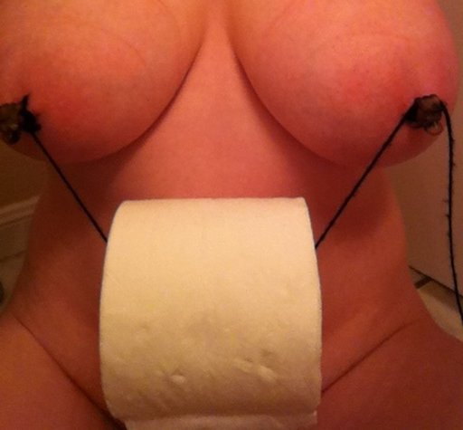 a bit of string between her nipples helps her dispense toilet paper