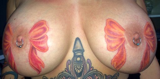 tattooed and pierced tits