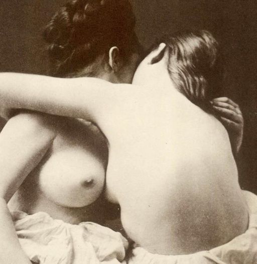 lesbian titties rubbed together in a firm embrace and kiss