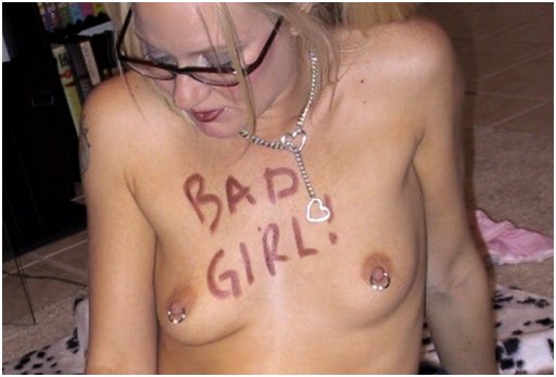 woman with bad girl written on her breasts